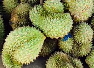 Several durians at a market in Cambodia