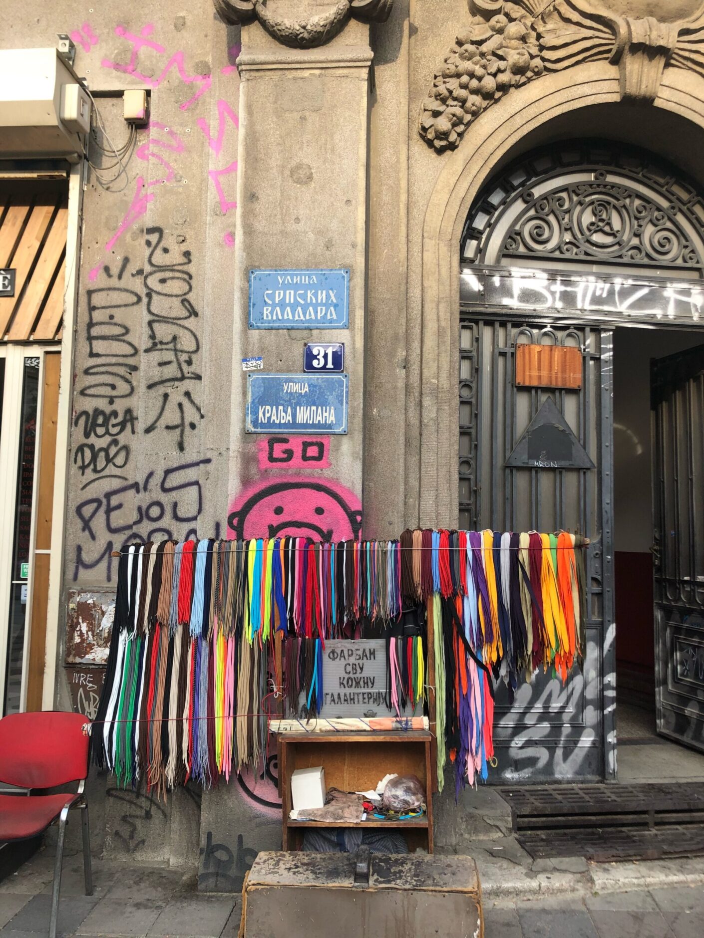 A stand with a collection of colorful shoelaces 