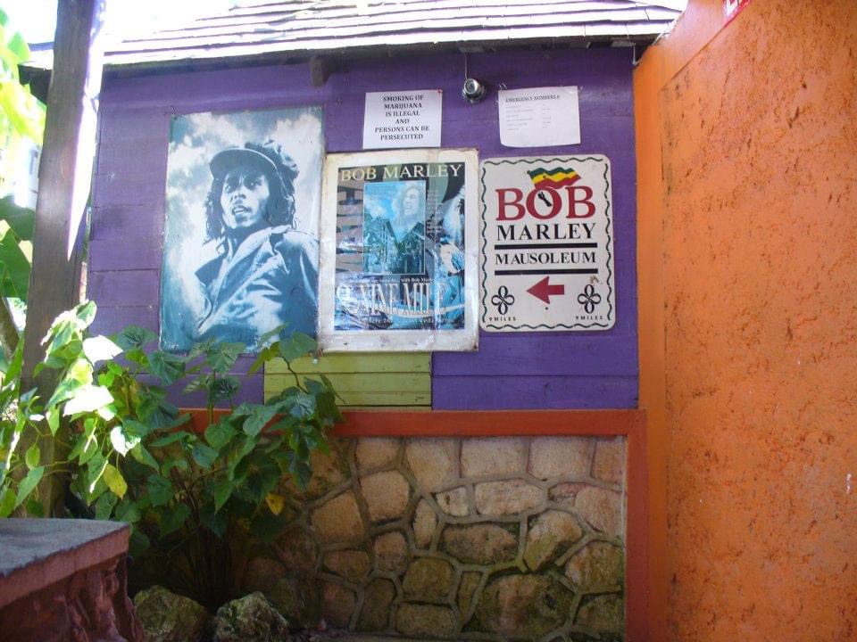 Posters of Bob Marley on a purple wall at the Bob Marley Mausoleum in Nine Mile Village in Jamaica