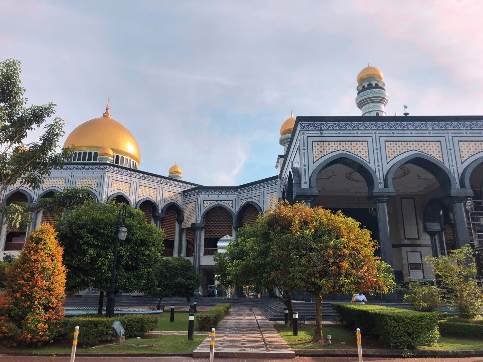 An expansive mosque with numerous domes, highlighting its impressive size and architectural beauty