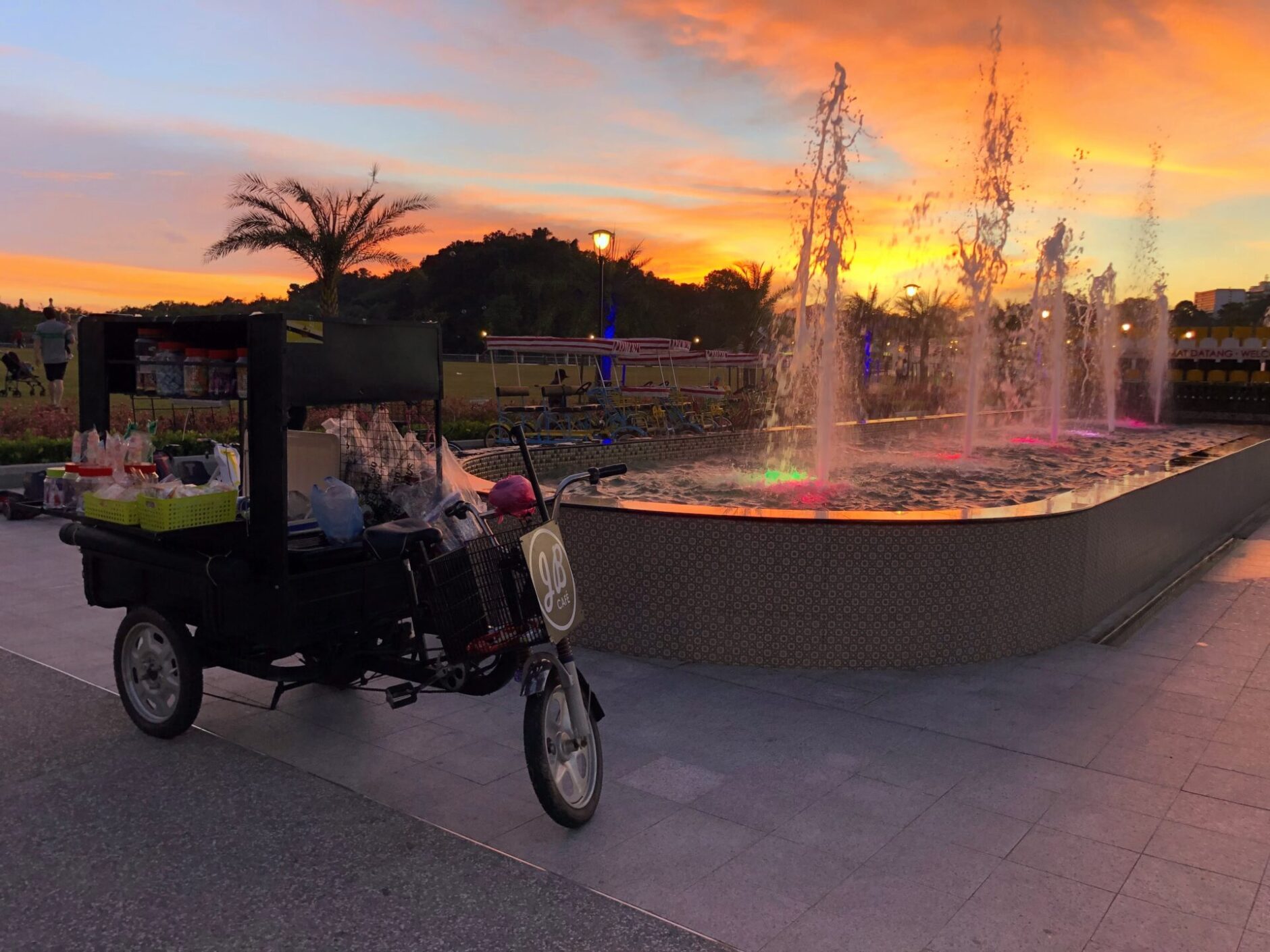 A bike featuring a cart, perfect for carrying items or making deliveries