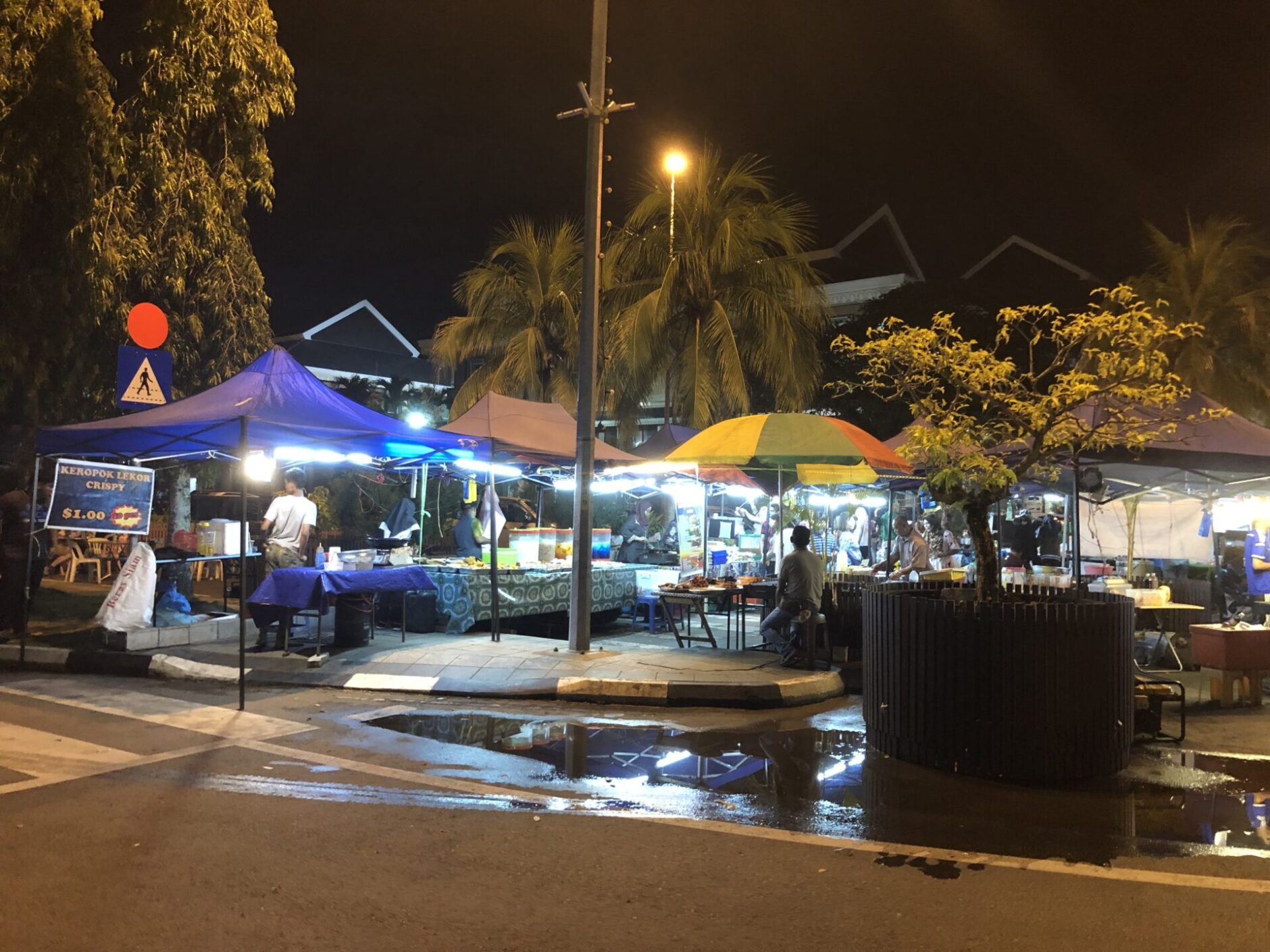 A lively street scene showcasing a market with vendors and customers enjoying the vibrant atmosphere