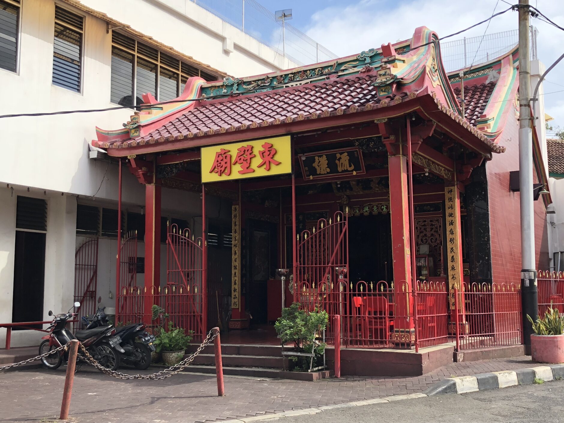 Tay Kak Sie a small Chinese temple with red tile roof and red columns