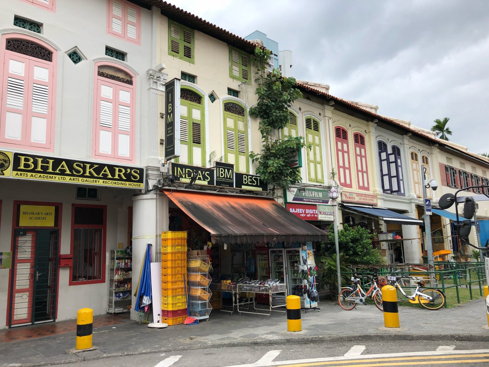 A row of traditional shophouses with colourful shutters in Little India in Singapore