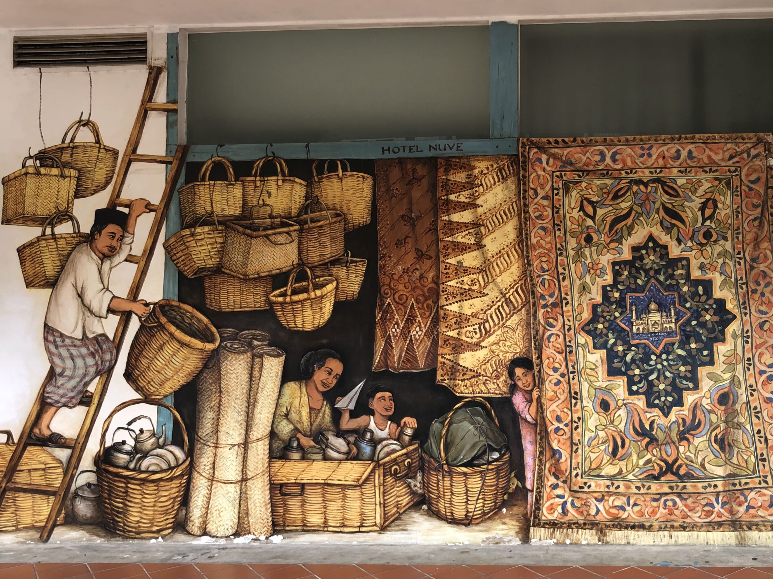 Kampong Gelam mural featuring a Malay family with woven baskets and carpets by Yip Yew Chung in Kampong Glam, Singapore