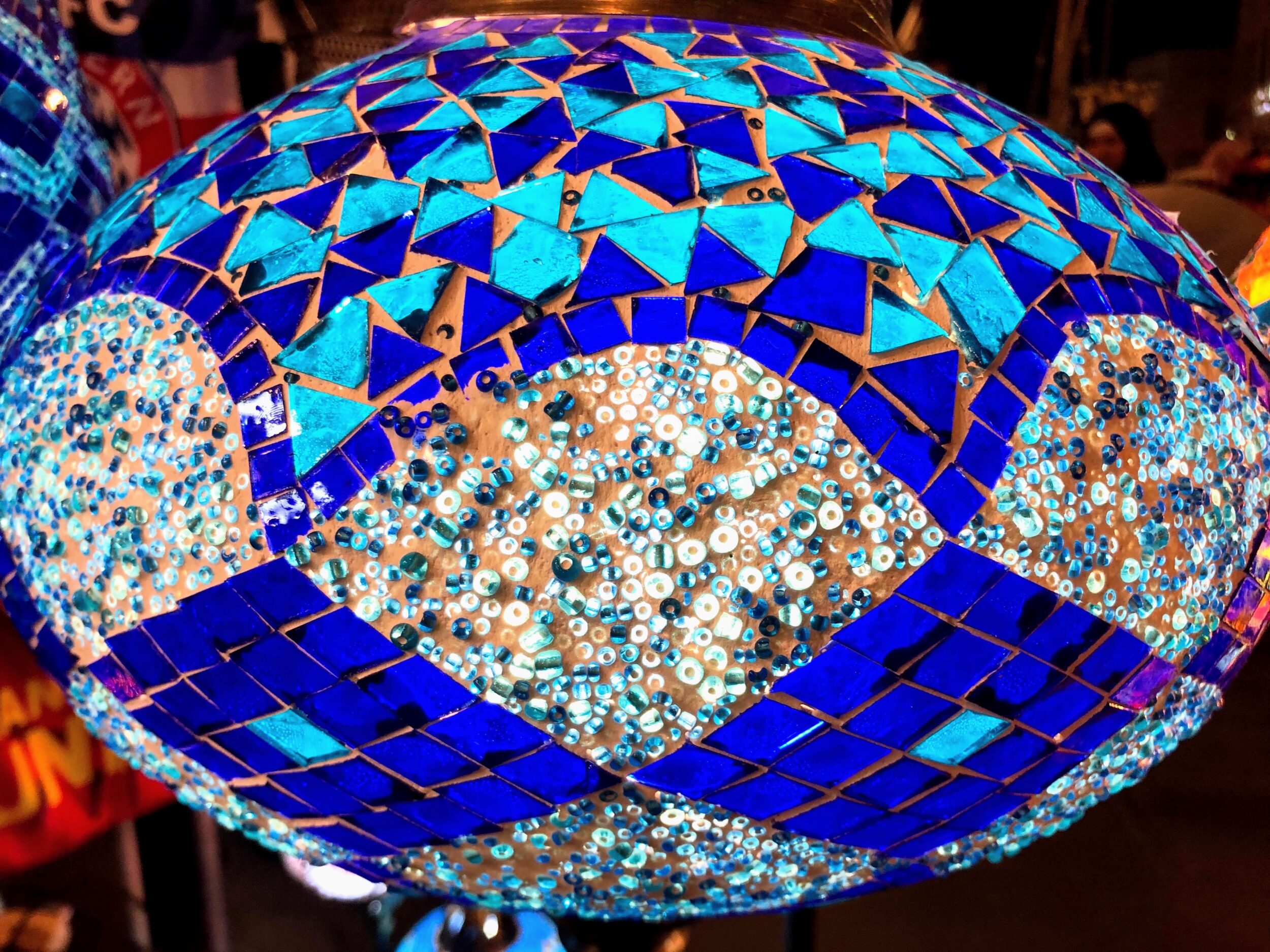 Traditional blue glass mosaic lantern hanging in a shop in Souq Waqif in Doha, Qatar