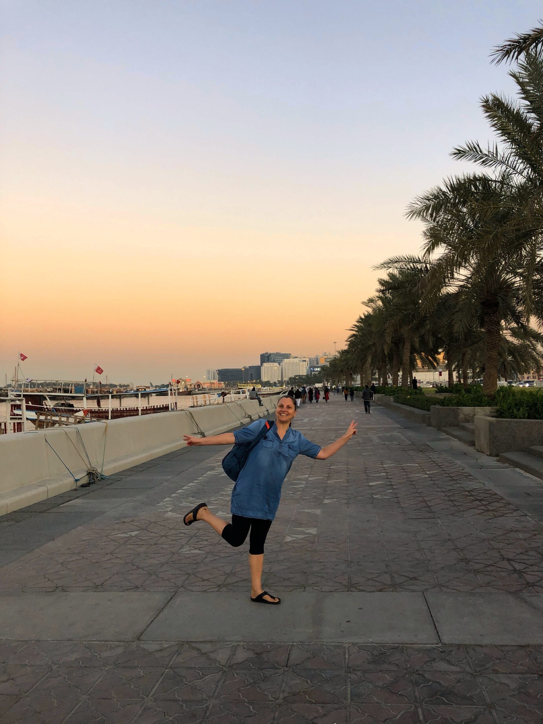 Walking along Al Corniche at sunset in Doha, Qatar