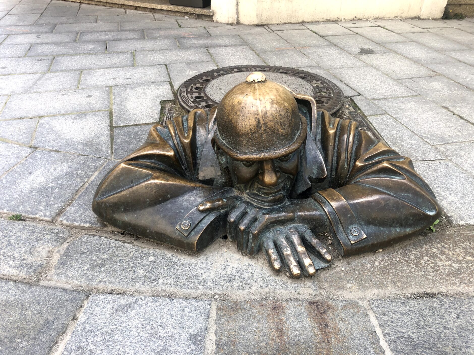 Bronze sculpture of Cumil the Sewer Worker in Bratislava, Slovakia